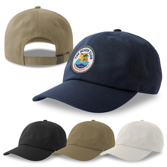 A collection of Dad Hats in navy, black, khaki, and cream, featuring a logo on the front of the navy cap.