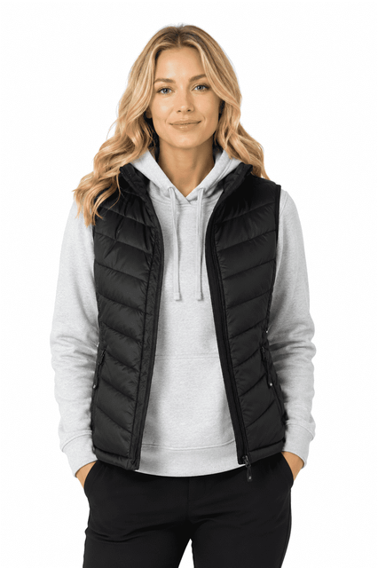 A black puffer vest worn over a grey hoodie, featuring a zip closure and a logo on the chest.