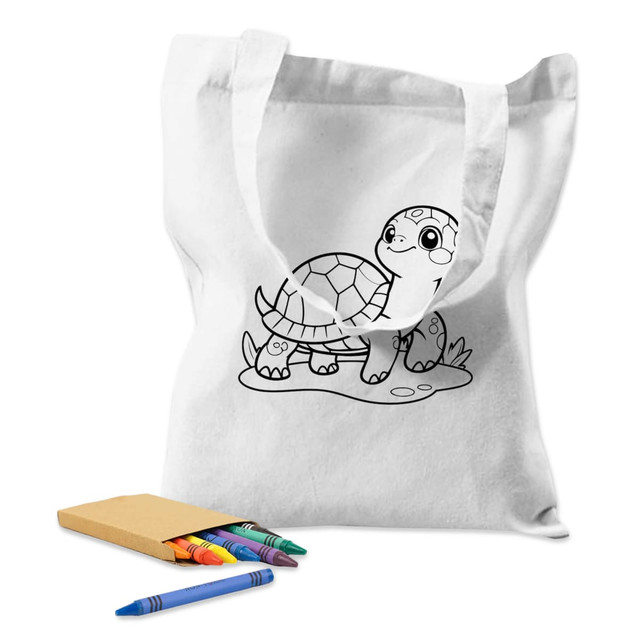 A white calico tote bag featuring a turtle illustration, accompanied by a set of colourful crayons.