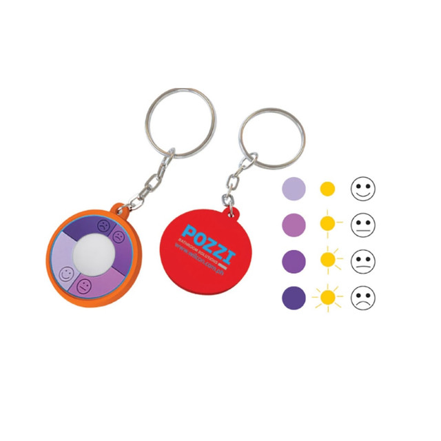 A keychain UV checker featuring a circular design in orange and purple with a logo on one side.