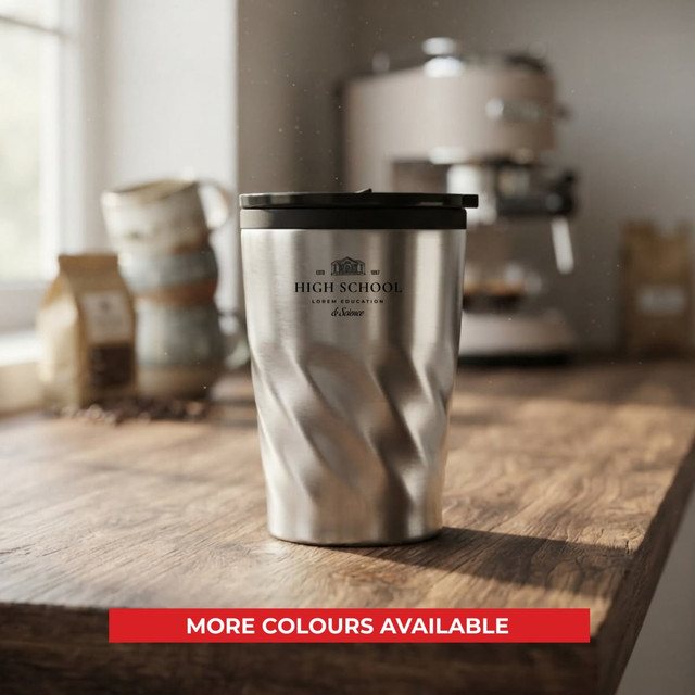 A stainless steel twist mug with a black lid, featuring a logo, on a wooden countertop.