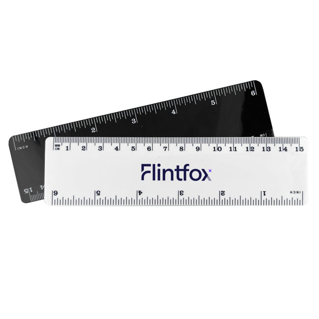 A 15cm plastic ruler in white and black, featuring measurement markings and a branding logo.