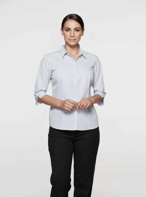 A light blue button-up shirt with 3/4 sleeves, featuring a collar and a logo. Suitable for women's wear.