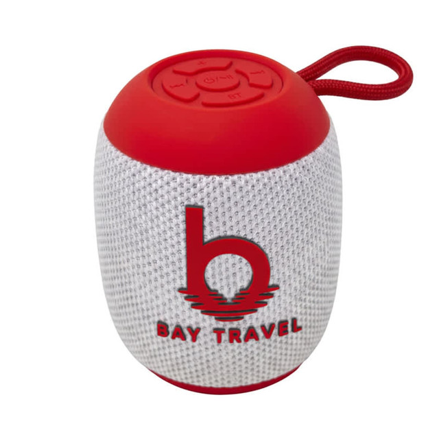 A red and silver Bluetooth speaker with a textured surface and a strap, featuring a logo on the front.