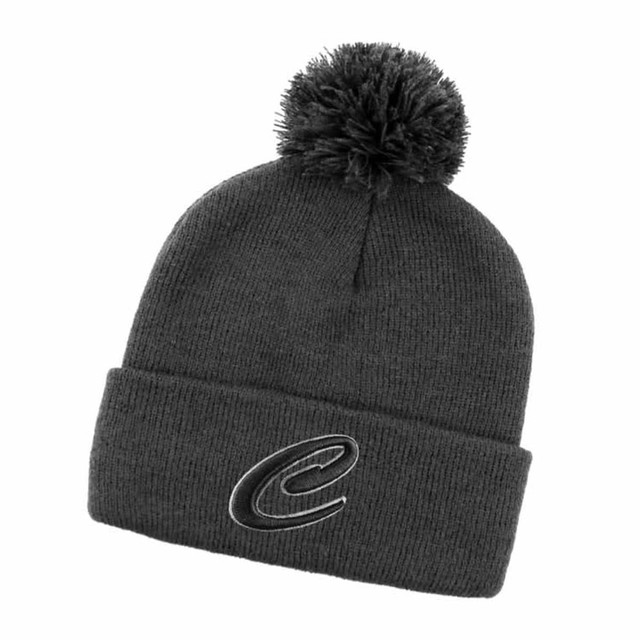 A dark grey beanie with a pom-pom on top and a logo on the front.
