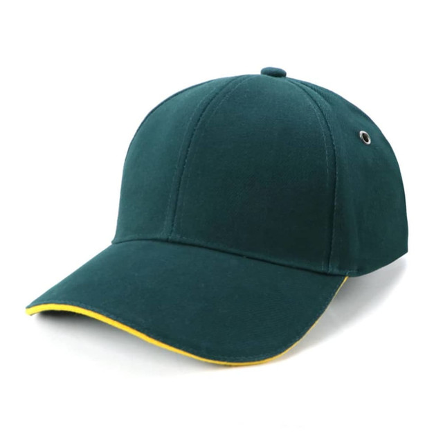 A green cap with a yellow trim, featuring a logo on the front and a curved brim.