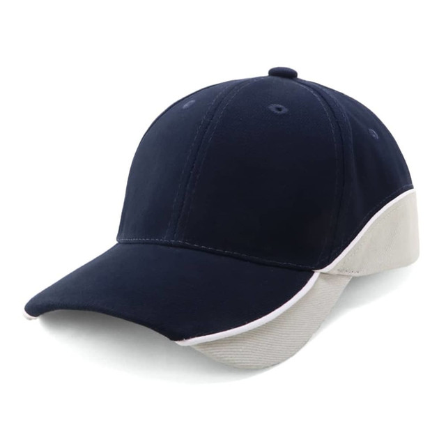 A navy cap with a cream underside and a logo at the back, designed for outdoor adventures.