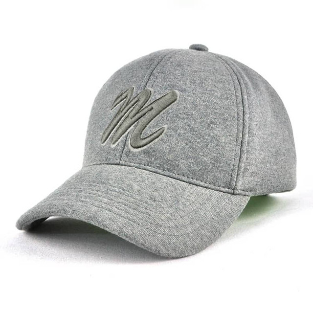 A grey cap with a curved brim and a prominent logo on the front.