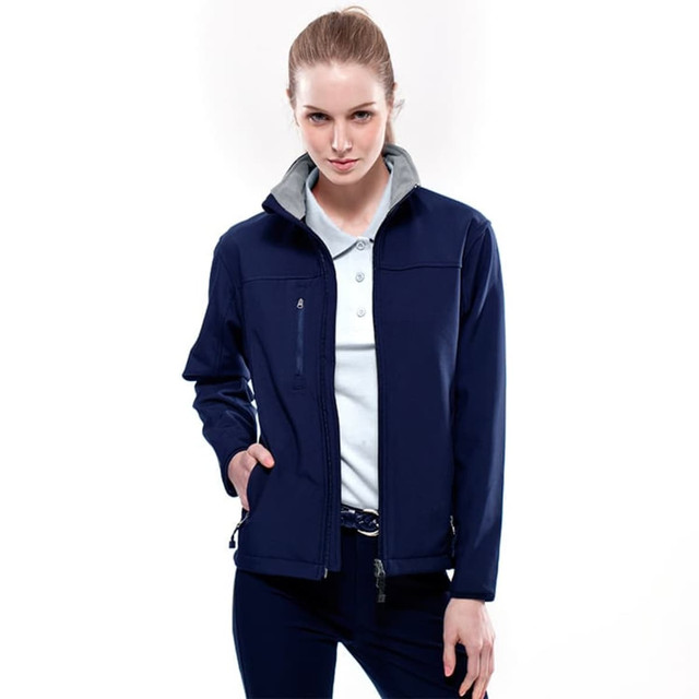 A soft shell jacket in navy, featuring a grey inner collar and a zippered front, with a branding logo visible.