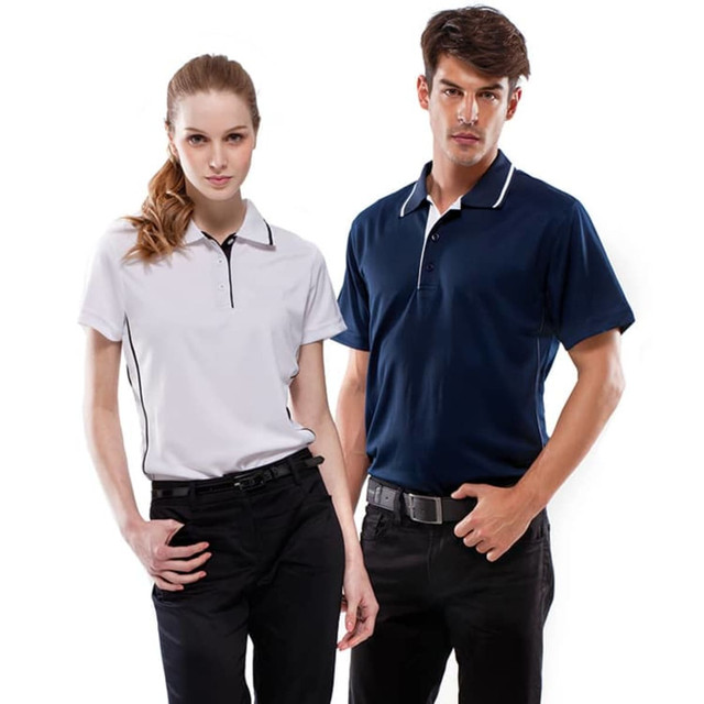 A white polo shirt and a navy blue polo shirt, worn by a woman and a man respectively, both featuring a logo.