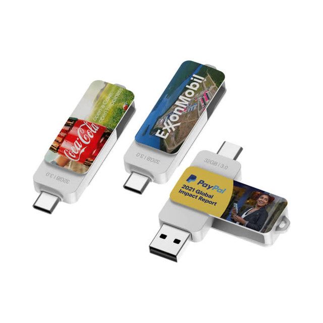 A collection of Twister Type-C flash drives in silver, featuring a variety of images and a logo on each.