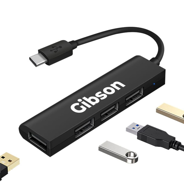 A black USB hub with four ports and a Type-C connector, featuring a logo on the side.