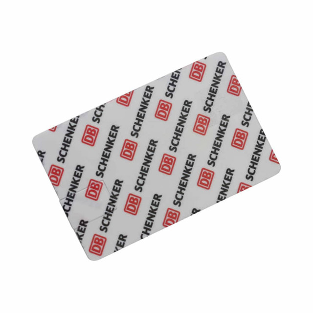 A credit card-sized flash drive with a white background featuring a red logo and repeated text pattern.