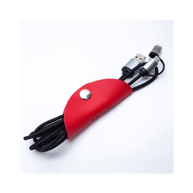 A red cord wrap neatly holds two black charging cables, featuring a snap button and an embossed logo.