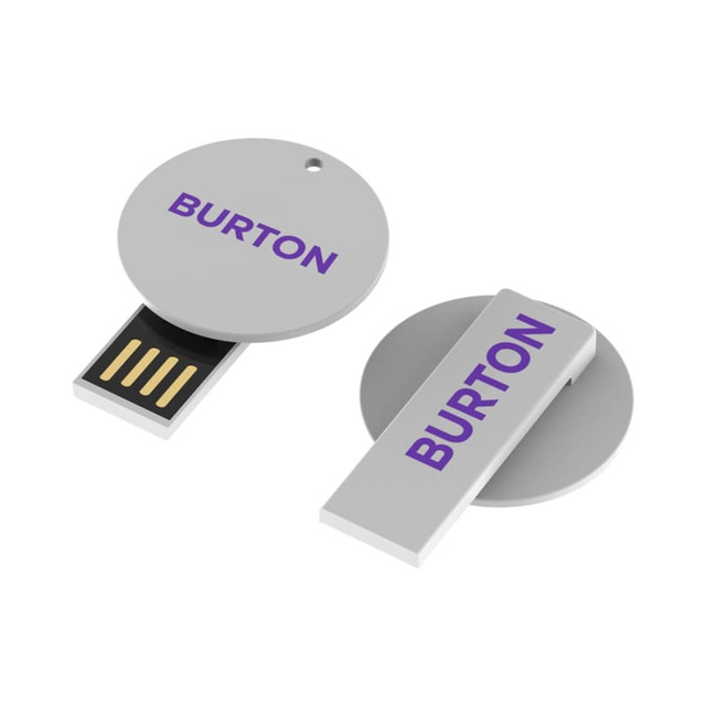 A grey Burton Clip Flash Drive with a circular and rectangular design, featuring a logo.