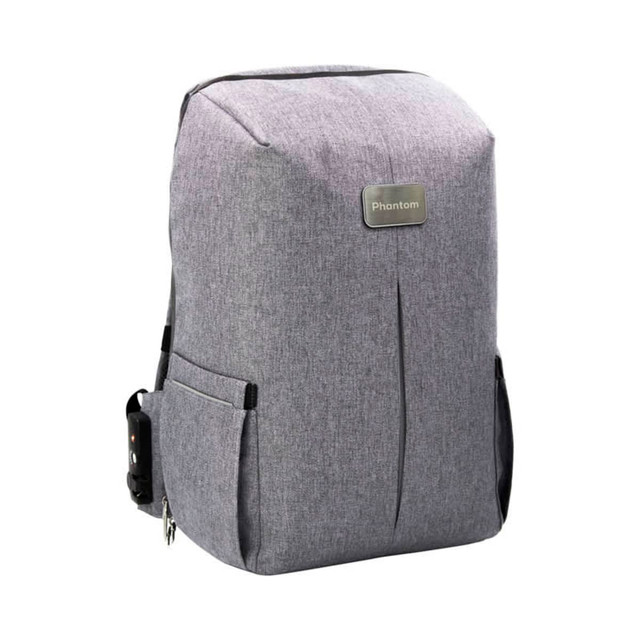 A grey backpack with a sleek design, featuring side pockets and a logo on the front.