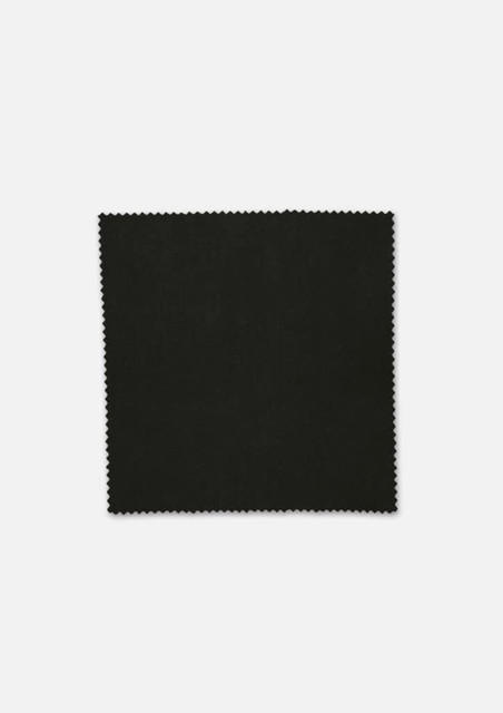 A square piece of black fabric with a fine, textured edge, showcasing a plain design.