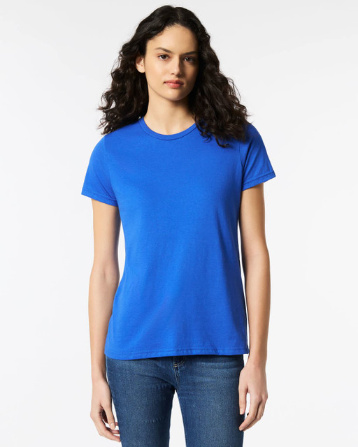 A blue Gildan Softstyle ladies' t-shirt displayed on a model, featuring a simple design and round neckline.