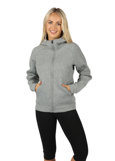 A grey women's junior hoodie featuring a zip-up front and side pockets, modelled by a smiling woman.
