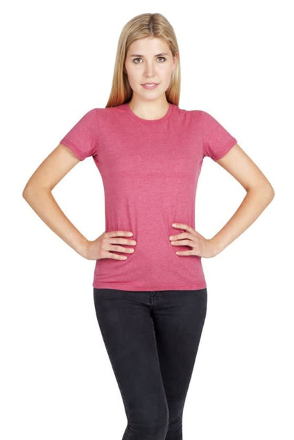 A model wearing a pink marl T-shirt, styled with black jeans, featuring a logo on the shirt.