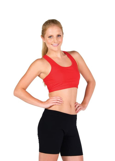 A woman in a red crop top and black shorts poses confidently, showcasing the sports uniform design.