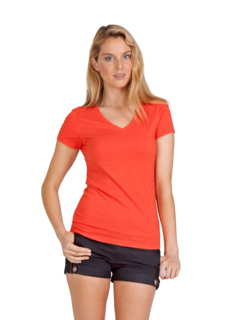 A woman wearing an orange marl V-neck T-shirt paired with black shorts and sandals, posing against a plain background.