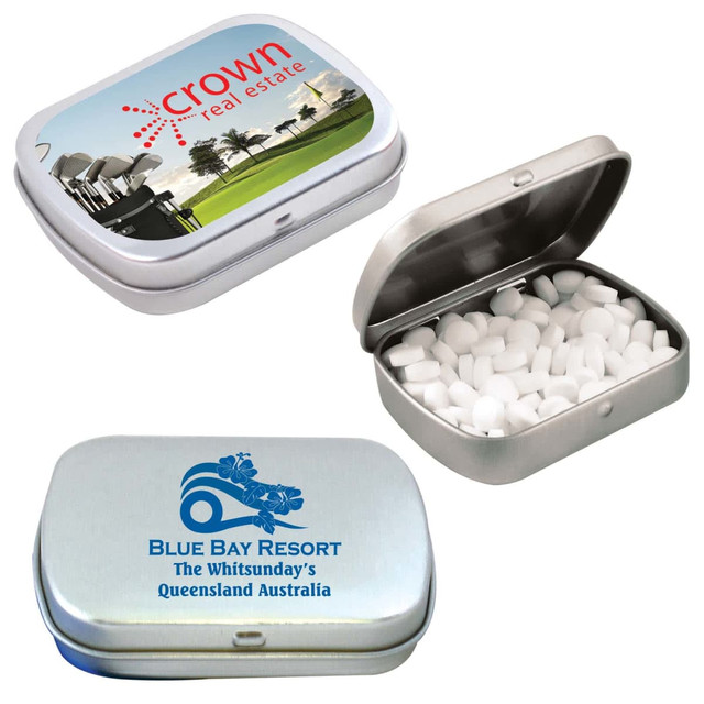 A silver tin filled with white sugar-free breath mints, featuring different printed designs on the exterior.