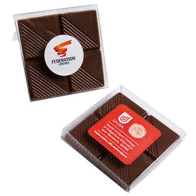 A chocolate square in a clear PVC stand-up box, featuring a textured brown chocolate surface and logos on the packaging.
