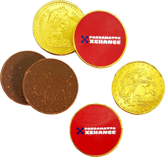 A selection of chocolate coins in gold and brown, featuring round shapes with a branded logo on one side.