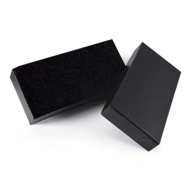 A black gift box set with a sleek exterior. One box features a textured top, while the other has a smooth finish.