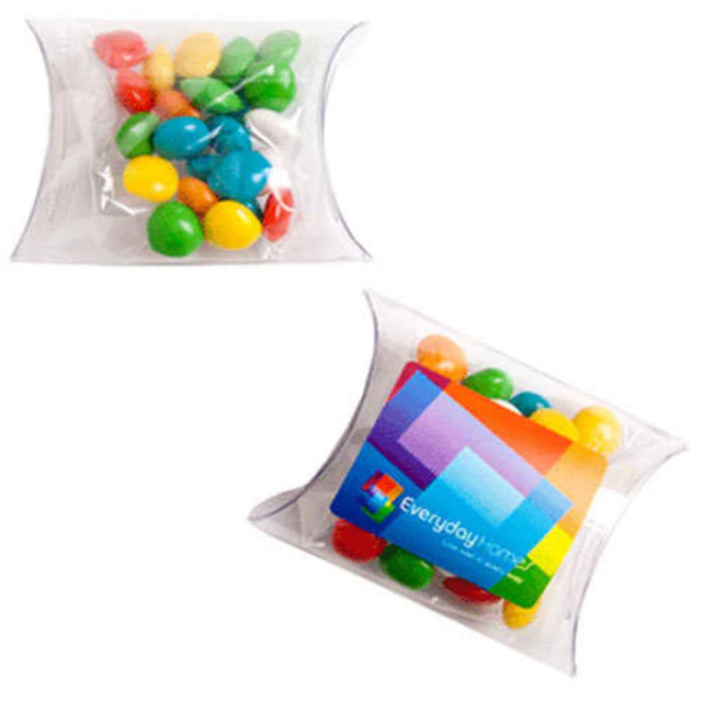 A clear pillow pack containing colourful chewy fruit candies in blue, green, yellow, and red, with branding on one side.