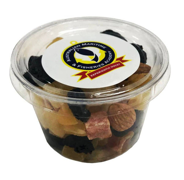 A clear tub filled with a fruit and nut mix, featuring various colours including black, brown, and yellow pieces.