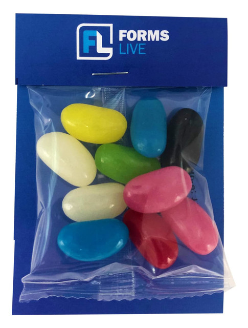 A clear bag containing assorted jelly beans in vibrant colours including pink, blue, yellow, and black, with a branded backing.