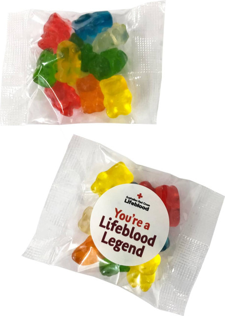 A clear packet containing colourful gummi bears in various shapes, with a logo and text on the packaging.