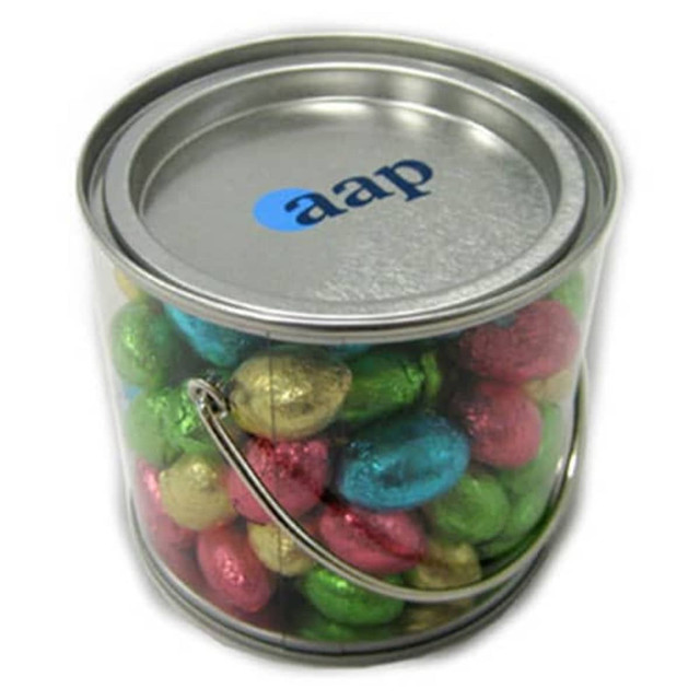 A medium silver bucket filled with colourful mini Easter eggs in gold, green, pink, and blue, featuring a logo on the lid.