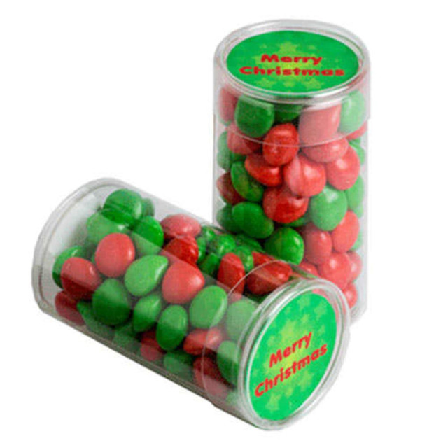 Two clear tubes filled with red and green chewy fruits, themed for Christmas. The tubes feature a logo or branding.