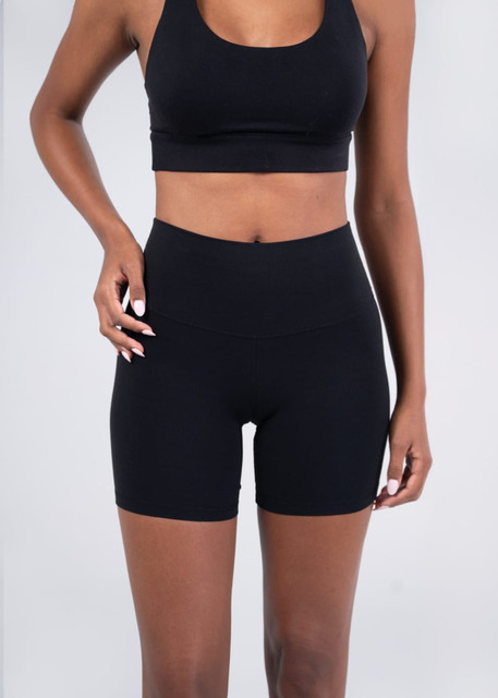 High rise legging shorts in black, featuring a smooth waistband and a fitted design. Includes a logo.