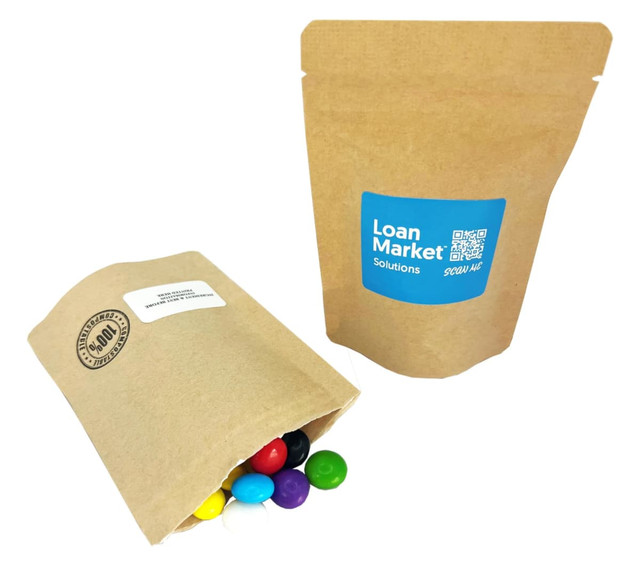 A compostable bag containing colourful choc beans, featuring a logo and a recyclable kraft packaging design.