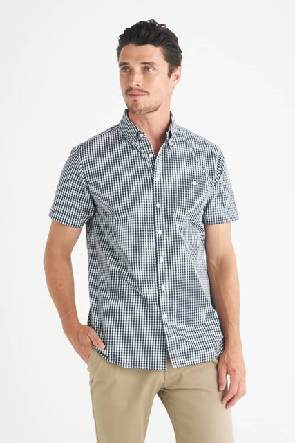 A men's short sleeve button-up shirt featuring a navy and white gingham pattern and a logo.