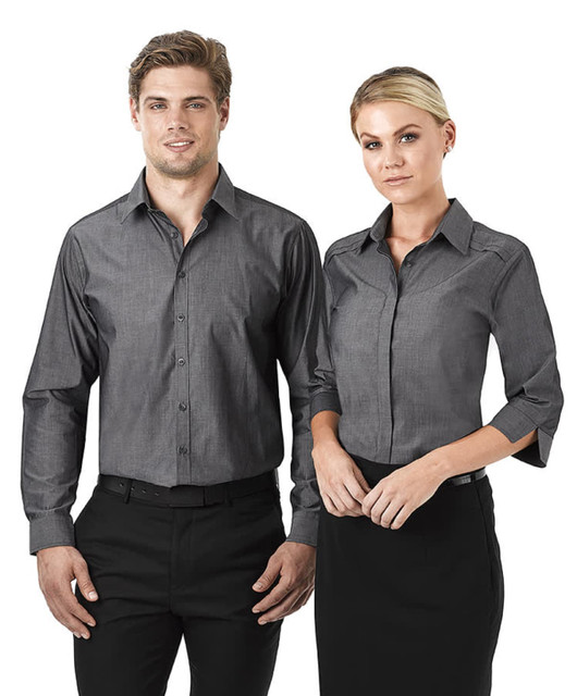 A grey, button-up long sleeve shirt for ladies, displayed on a model alongside a male model in a matching style.