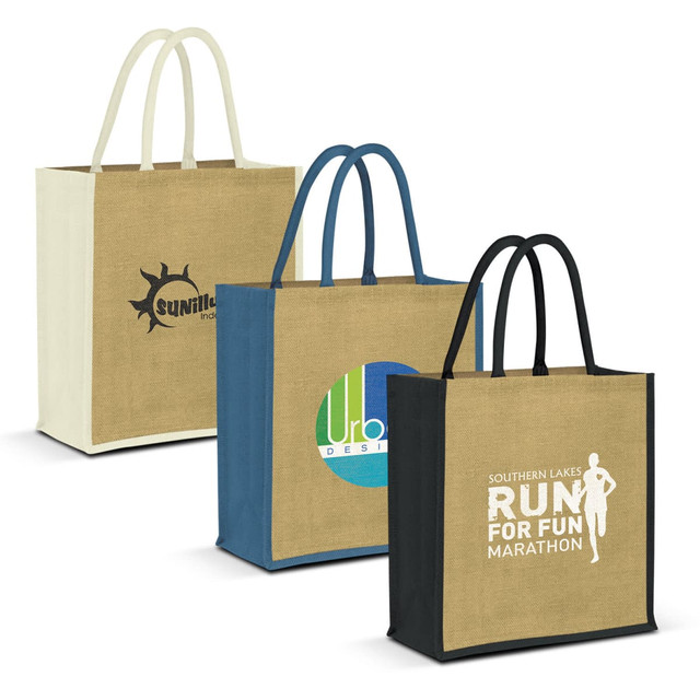 Three jute tote bags in beige, blue, and black with handles, each featuring different logos and designs.
