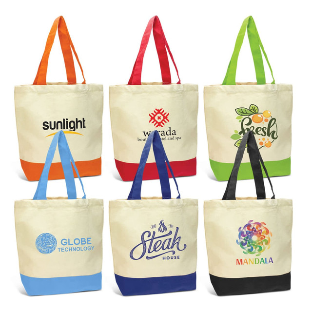 A collection of canvas tote bags in various colours, featuring different logos and designs.