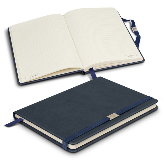 A navy notebook with a textured cover, featuring lined pages and a ribbon bookmark. It has a logo on the cover.