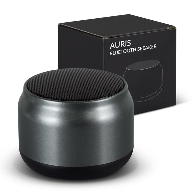 Auris Bluetooth speaker in sleek grey, with a rounded design, alongside its black packaging featuring branding.