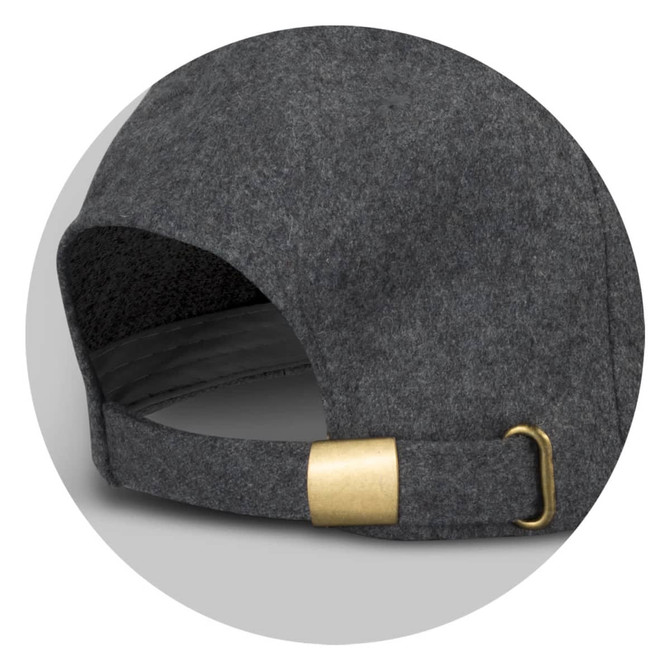 A grey felt cap featuring a curved brim and a brass buckle at the back, complete with a logo.