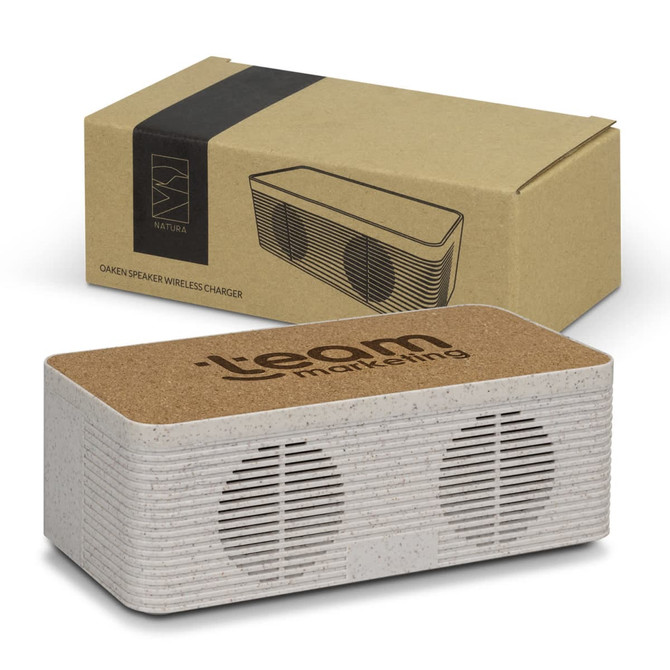 A wireless charger and speaker in grey with a cork top, displayed with its brown packaging.