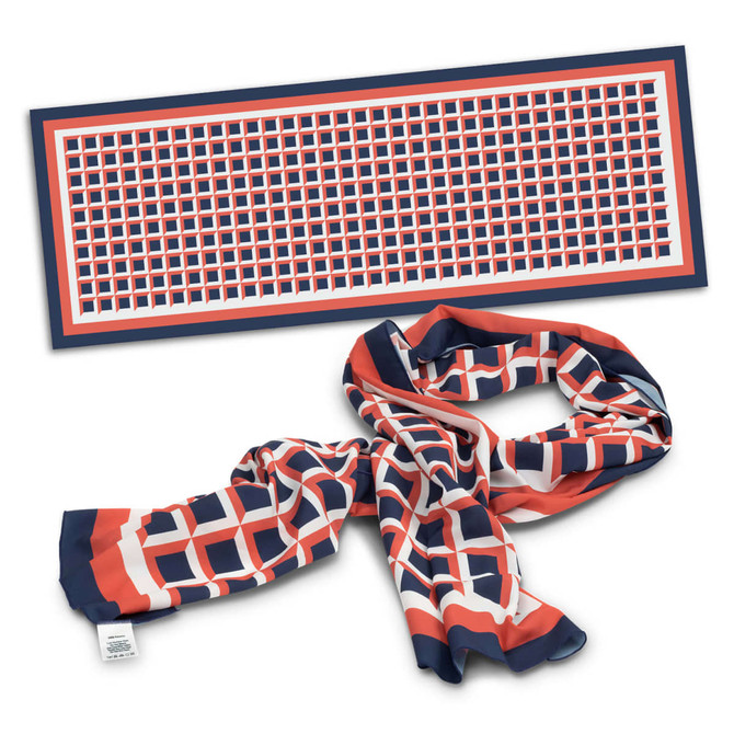 A vibrant Berlin Scarf featuring a geometric pattern in navy, red, and white, with a branding label.