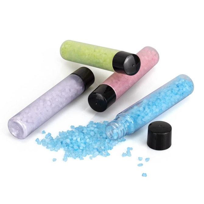 A set of four containers of bath salts in blue, pink, green, and purple, with black caps, one spilling salts.
