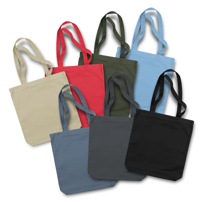 A collection of canvas tote bags in various colours including red, green, blue, black, and beige, with matching handles.