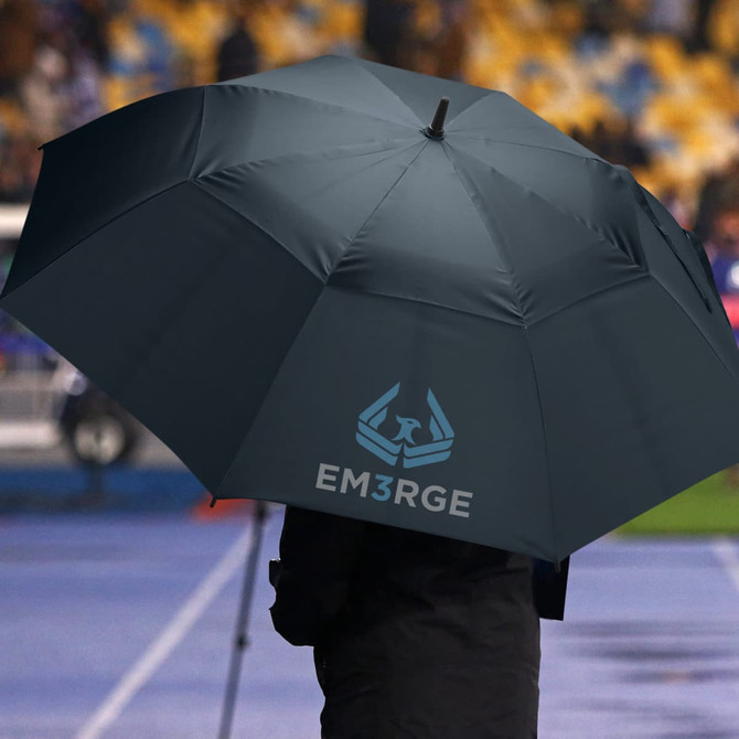 A dark green sports umbrella held by a person, featuring a logo on one side.